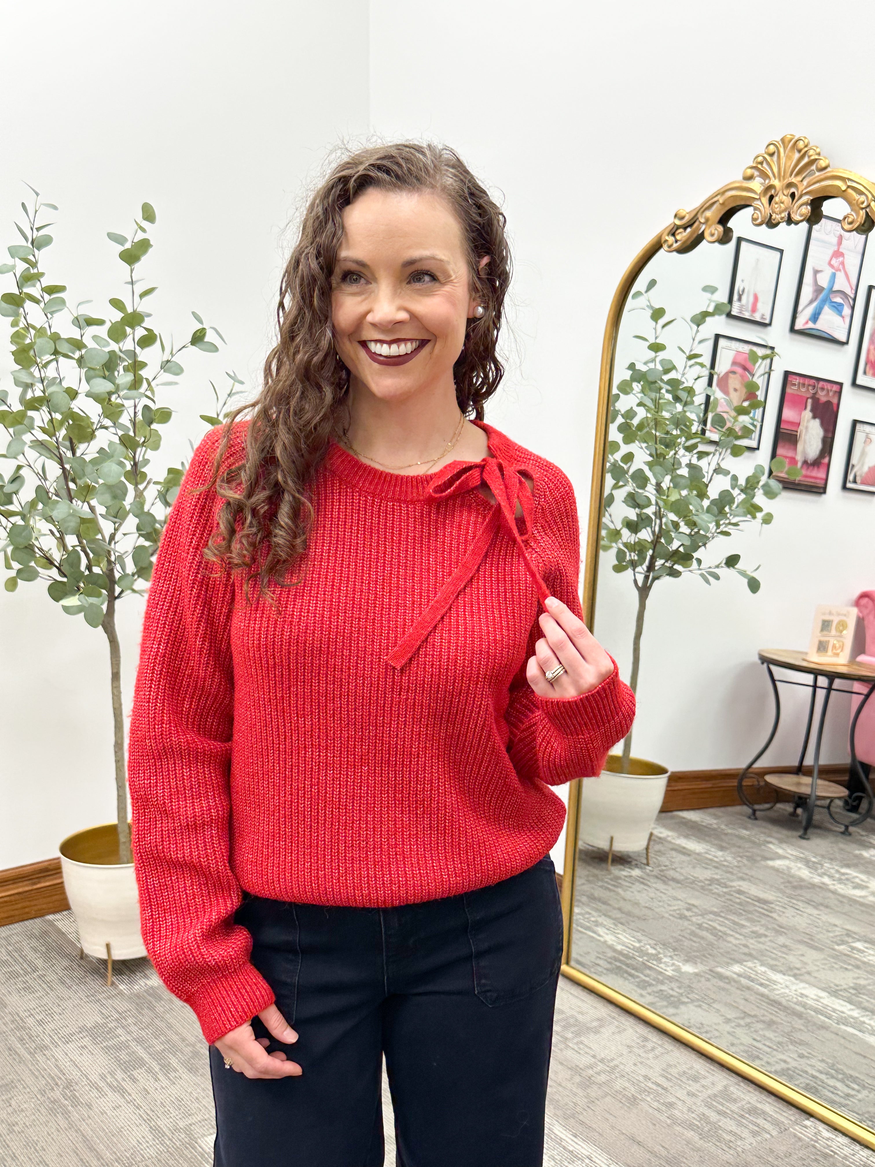 Red Sweater With A Tie At The Neck